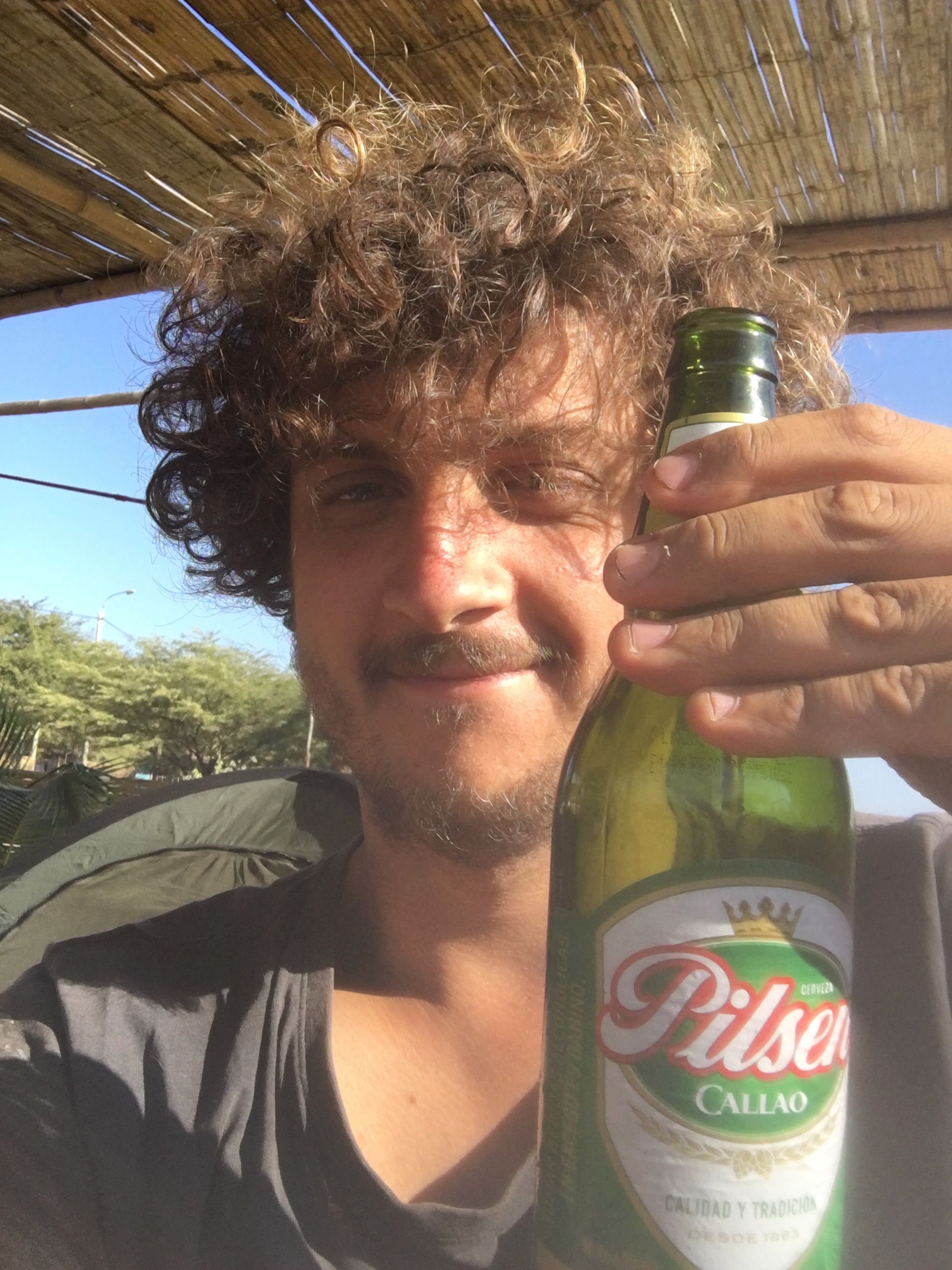 having a beer in Lobitos - bicycle touring through the Peruvian desert 